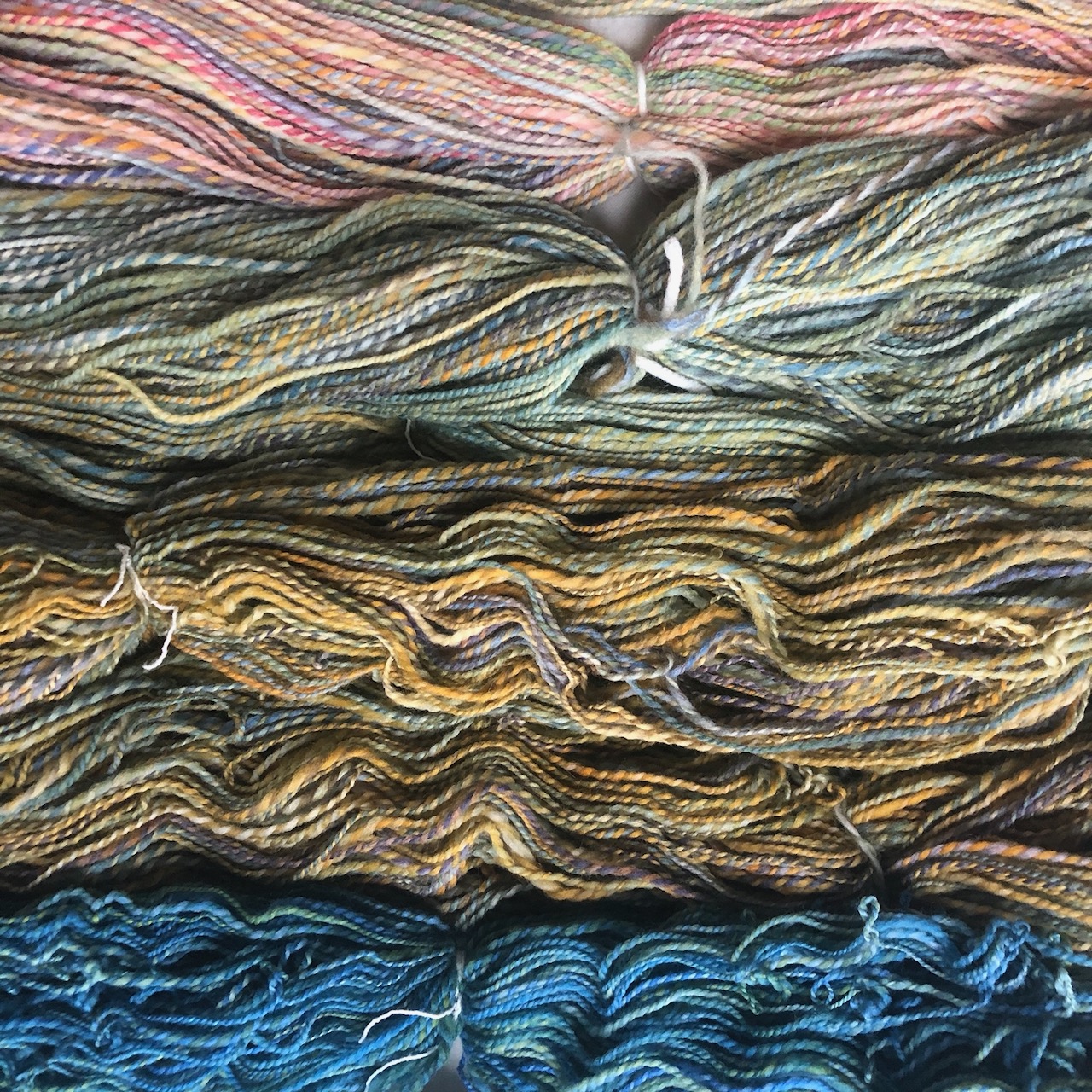 Spun yarns (Merino and/or Columbia, hand-dyed)